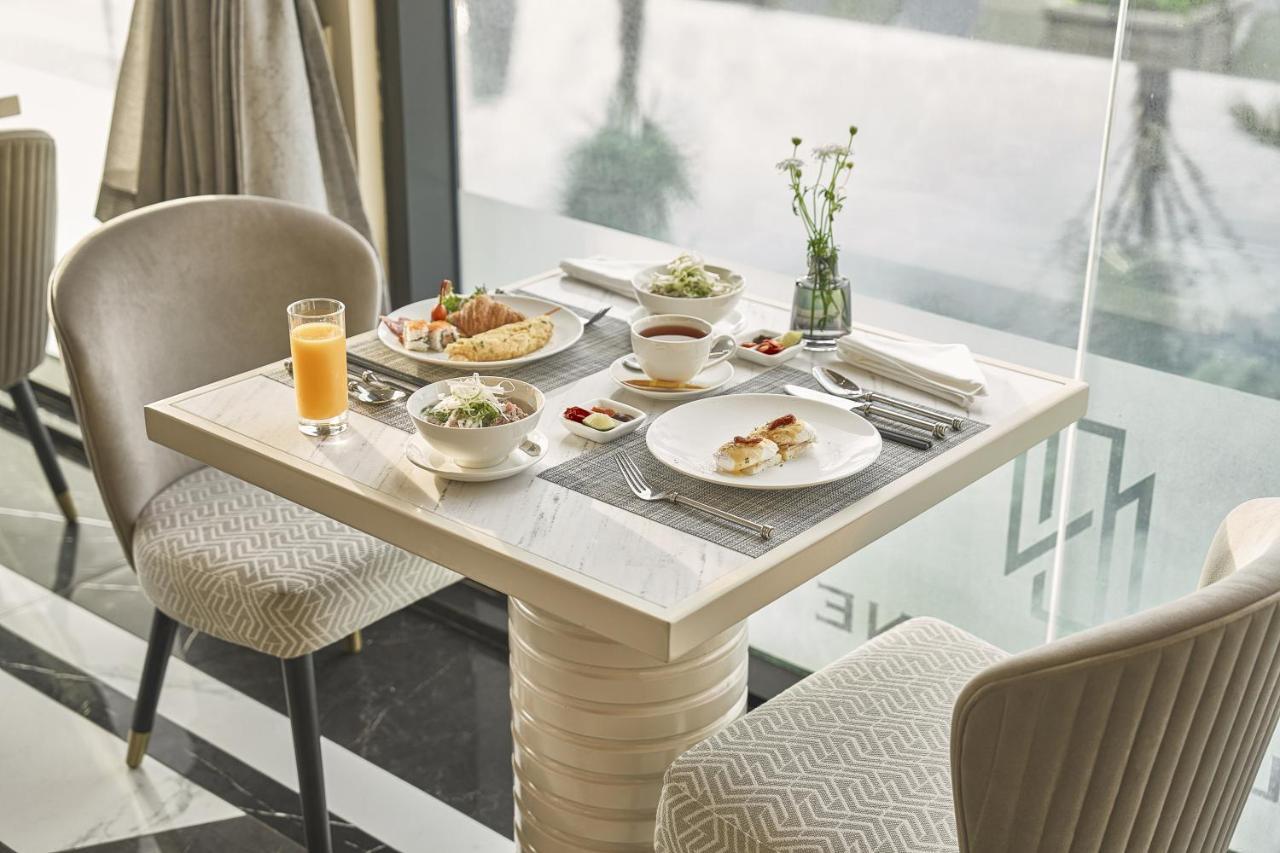 La Siesta Premium Saigon Hotel Ho Chi Minh City Bagian luar foto A table set for breakfast